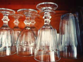 Close-up of glasses on wooden table