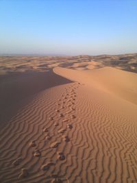 Footprints on sand in desert