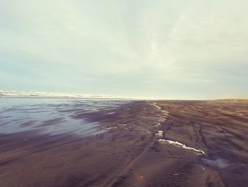 Scenic view of beach against sky