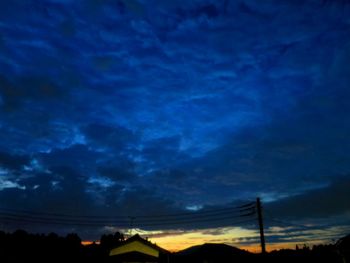 Low angle view of dramatic sky at sunset