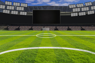 View of soccer field against cloudy sky