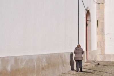Woman walking on wall