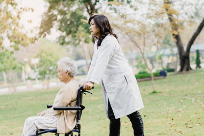 Side view of doctor with patient at park