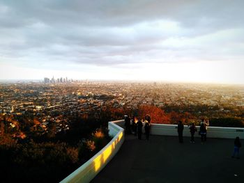 People in city against sky