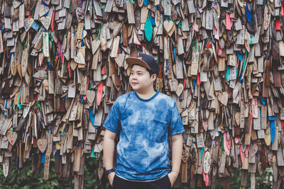 Portrait of boy wearing hat standing outdoors