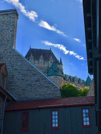 Low angle view of building against blue sky