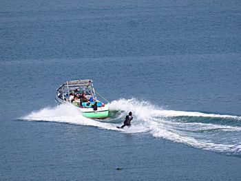 Person surfing in wake of motorboat
