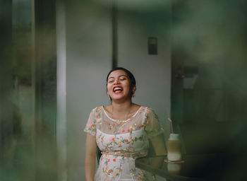 Portrait of a smiling girl standing outdoors