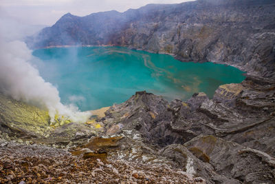 Smoke emitting from volcanic mountain
