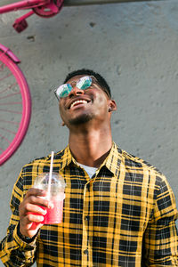 Young man drinking water from bottle