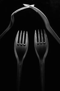 Close-up of fork over black background