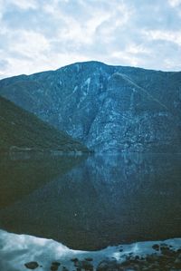 Scenic view of lake against sky during winter
