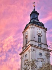 Low angle view of building against sky during sunset