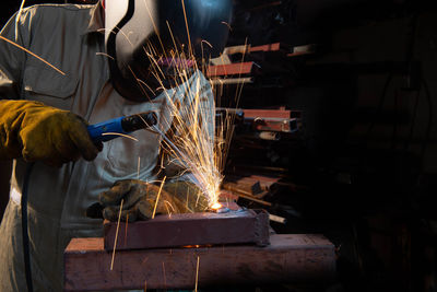 Man working on metal in factory