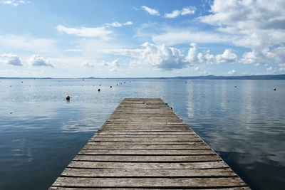 Pier over sea against sky