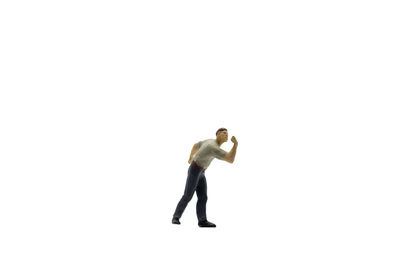 Full length of man standing against white background