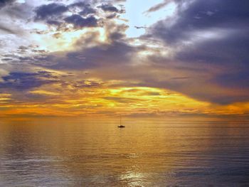 Scenic view of sea against dramatic sky