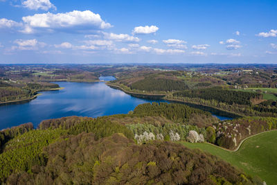 High angle view of river amidst landscape against sky