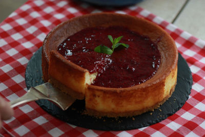 A slice of raspberry cheesecake