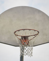 Low angle view of basketball hoop against sky