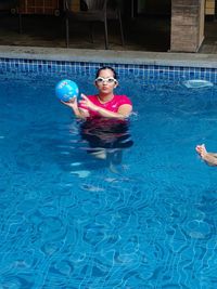 Young woman swimming in pool