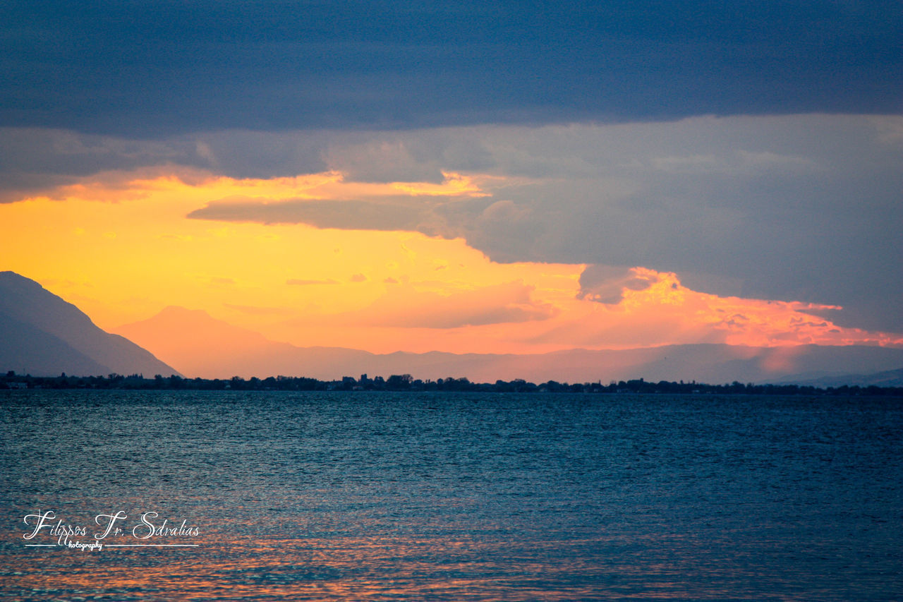 SCENIC VIEW OF SEA AT SUNSET