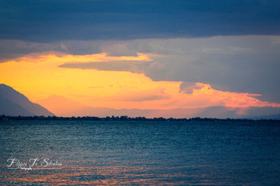 Scenic view of sea against sky at sunset