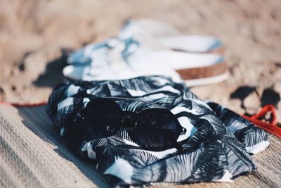 Sunglasses on scarf at beach