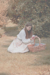 Woman in basket on field