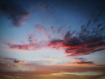 Low angle view of dramatic sky during sunset