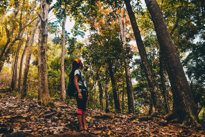 Woman standing in forest