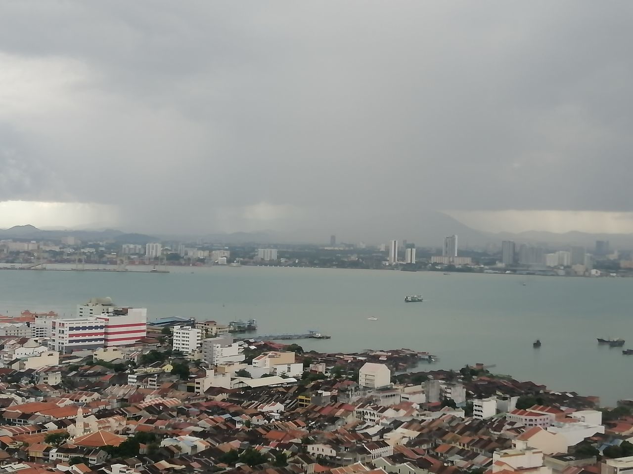 HIGH ANGLE VIEW OF BUILDINGS AGAINST SKY