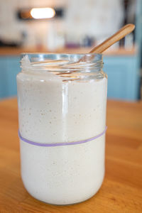 Close-up of drink in glass jar on table