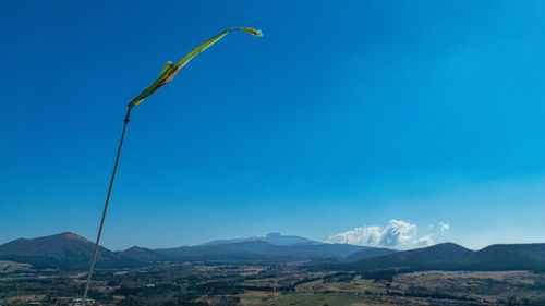 Low angle view of mountains against blue sky