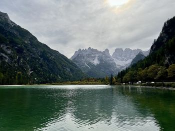 Scenic view of lake and mountains against sky