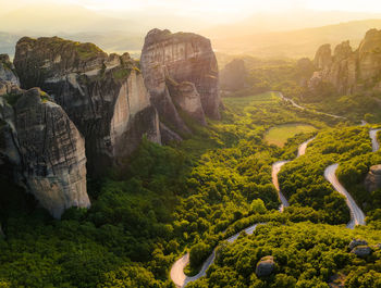 Meteora, greece, sandstone formations, sunset monasteries. travel destination. panoramic view