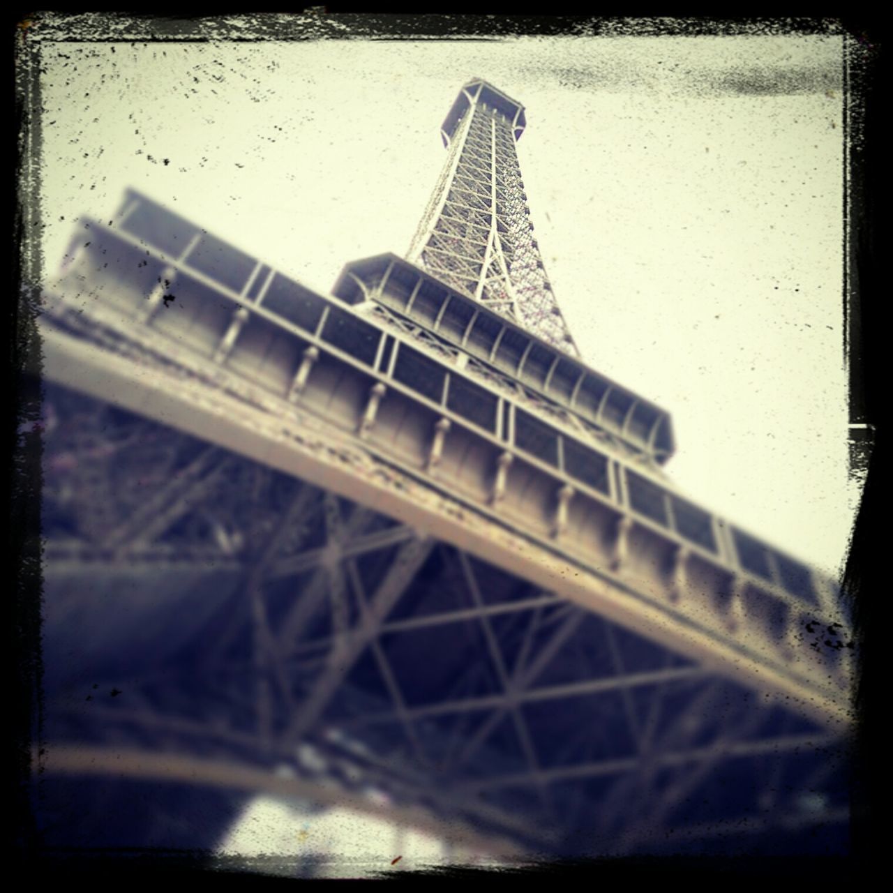 built structure, architecture, low angle view, transfer print, eiffel tower, tall - high, tower, building exterior, auto post production filter, metal, travel destinations, capital cities, famous place, sky, international landmark, culture, travel, city, tourism, tall