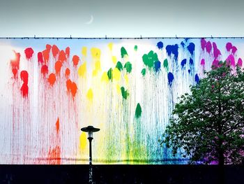 Close-up of multi colored water against sky