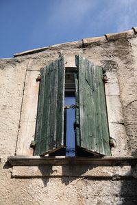 Low angle view of building against blue sky