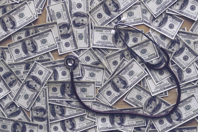 Us paper currency and stethoscope