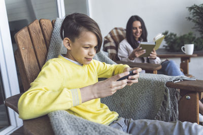 Friends sitting on mobile phone