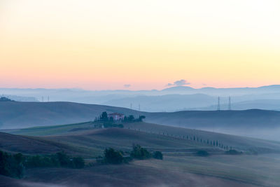 Scenic view of landscape against sky during sunset