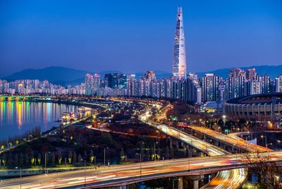 High angle view of illuminated buildings in city at night
