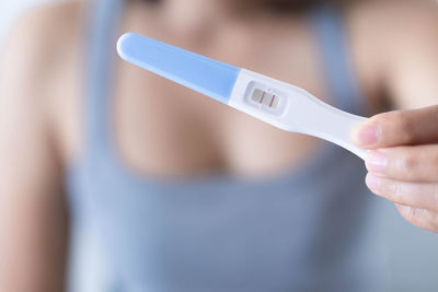 Close-up of woman holding hands