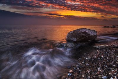 Scenic view of sea against cloudy sky