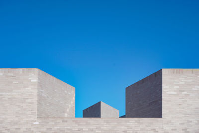 Low angle view of building against blue sky