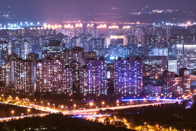 Illuminated cityscape at night