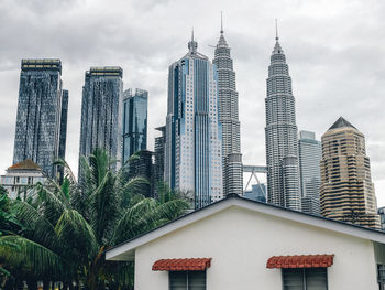 Buildings in city against sky