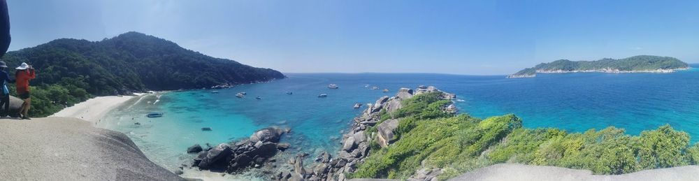 Panoramic view of bay against clear blue sky