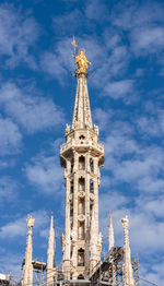 Low angle view of milan cathedral against sky